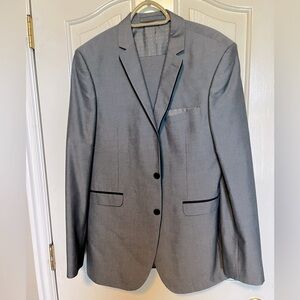 Modern slim-fit gray suit with black accents.